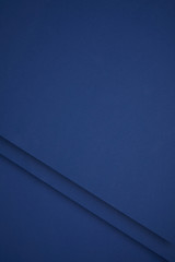 dark blue abstract background from colored paper