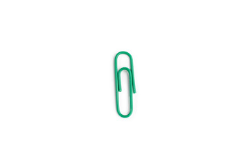 Green paper clip on a white background.