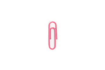 Pink  paper clip on a white background.