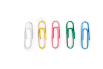 A lot of colorful paper clips on white background.
