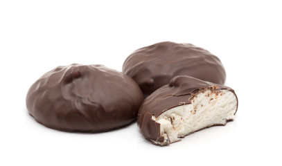 chocolate covered marshmallows on white background