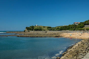 Saint-Jean-de-Luz coastline with the Sainte-Barbe belvedere and its chapel on a background.