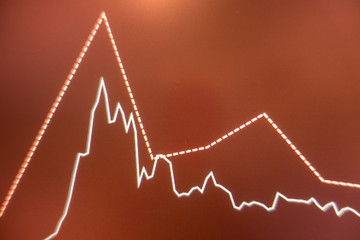Stock exchange market graph analysis in red background