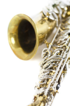 detail of an isolated in white portrait of an alto saxophone / detail of a gold and silver brass saxophone in white background
