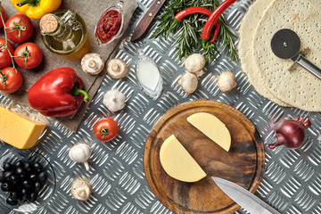 Ingredients for cooking pizza on metal table, top view