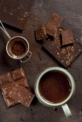 Hot chocolate cup and chocolate bars.
