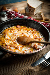 Scrambled eggs with sausage.