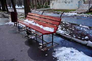 Red shop in the snow in the park.