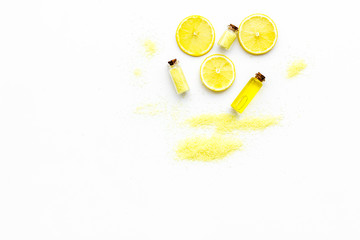 Aromatic yellow spa salt with lemon scent on white background top view copy space