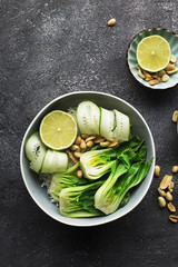 Rice boc choy lime cucumber vegetarian bowl for a healthy diet. Top View