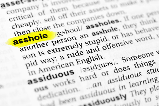Highlighted English word "asshole" and its definition in the dictionary