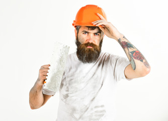 Plasterer, repairman, foreman takes off helmet or hard hat