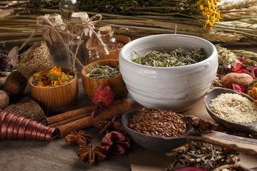 Bunch of healing herbs on wooden board. Herbal medicine. Top view.