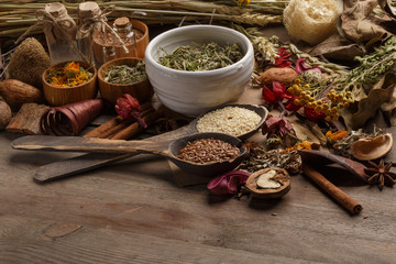 Bunch of healing herbs on wooden board. Herbal medicine. Top view.