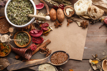 Bunch of healing herbs on wooden board. Herbal medicine. Top view. © Max