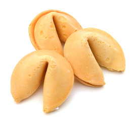 Many Chinese fortune cookies stacked up, on white background