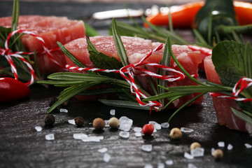 Raw beef fillet steaks mignon on dark background