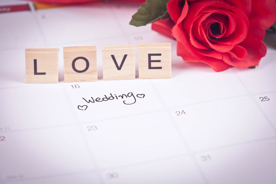 Reminder Wedding day in calendar planning and love letter on wood with color tone.