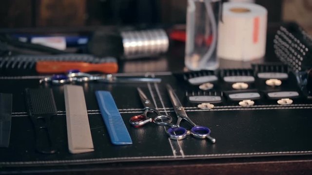 Close-up panorama shot of hairdresser tools. Scissors and combs.