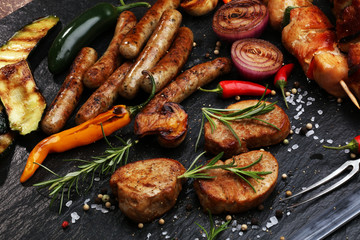 Assorted delicious grilled meat with vegetable on a barbecue