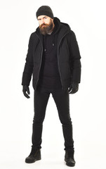Fototapeta na wymiar Winter clothes concept. Guy wears black and brutal outfit.