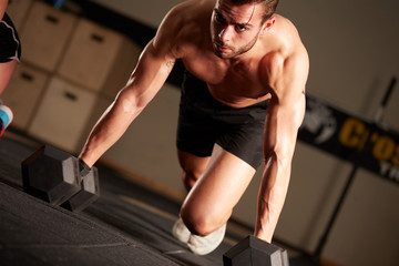 Obraz premium Crossfit lessons in fitness club