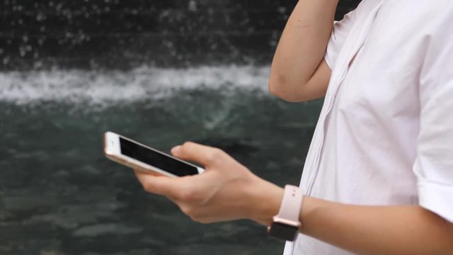 Woman Hands Pairing AirPods Earphones With Smart Phone And Smart Watch