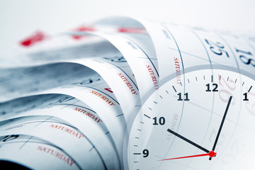 wall calendar with the number of days and clockface