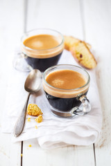 Good morning concept - Two cups of espresso coffee for breakfast on a white napkin against white...