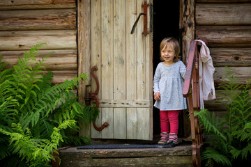 little girl standing and laughing