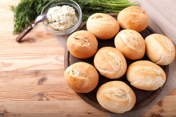 Fresh Rolls with garlic,  butter and greens. Delicious buns. Top view