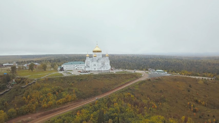 Aerial View of Church And Landmark, Golden Yellow Domes on outdoor at Autumn Season. Clip. Top view on church in autumn