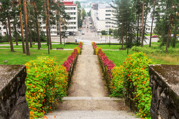 Stone stairs with flowers in city park
