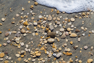 Fototapeta na wymiar beautiful round stones on the beach