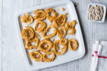 Fried Crispy Calamari Squid Rings with Tartar Sauce and Lemon.