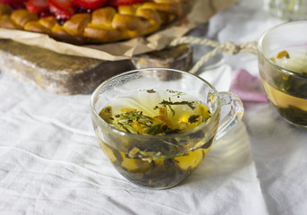 Flower herbal green tea on dinning table with homemade cake