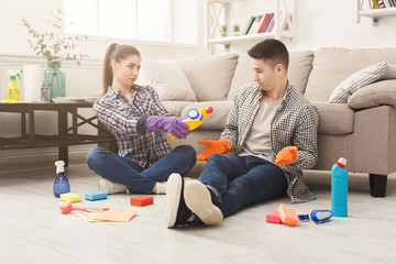 Couple cleaning at home together