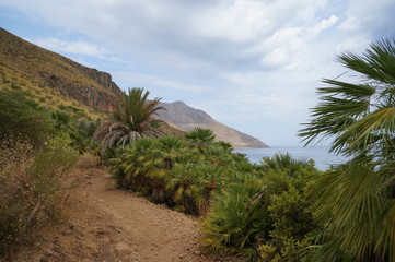 Fototapeta na wymiar Walking path in mountains next to the sea