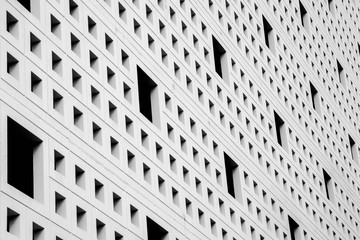 pattern of air ventilation at modern concrete building, light and shadow - monochrome