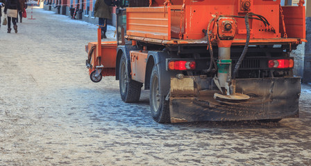 Snow removal vehicles in the street in winter