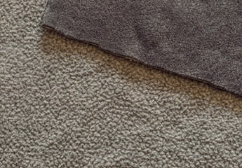Fototapeta na wymiar Bilateral beige and brown polar fleece fabric texture close up