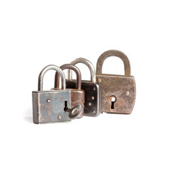 Fototapeta premium Retro style padlocks on white background. metal textures pattern. key in hole
