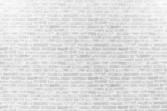 Abstract weathered textured on white brick wall background.