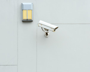 CCTV Camera on the grey concrete wall
