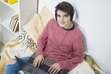 teenager or student working with the computer at home