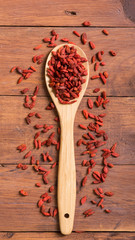 Goji berries in wooden spoon