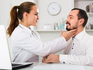 Fototapeta premium Young man patient visiting consultation with doctor