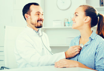 Smiling male doctor consultation woman patient