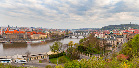 Fototapeta na wymiar Wide panoramic view of Prague over Vltava river. Heart of old town. Czech Republic. Spring time.