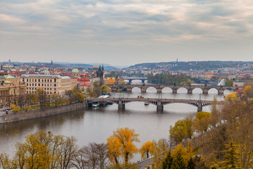 Fototapeta na wymiar Ancient bridges of Prague over Vltava river. Heart of old town. Czech Republic. Golden autumn time.
